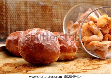 Donuts and faworki. Traditional Polish cookies on Fat Thursday and space for text
