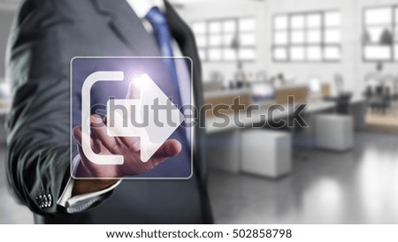 businessman pressing an exit symbol in front of an office scene