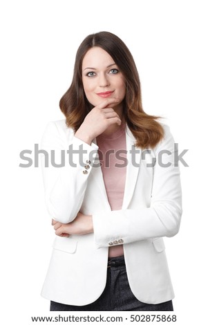 Portrait of smiling young businesswoman standing with arms crossed at isolated background.