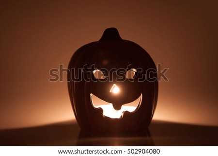 Halloween - Jack-o-lantern pumpkin with candlelight