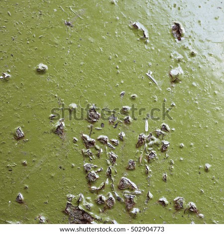 Sheet of old rusty metal with peeling paint, texture background