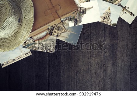 Travel concept. Old photos on wooden background.