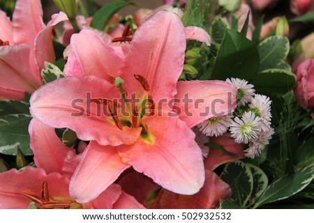 Pink tiger lily in a bridal arrangement