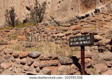 Do Not Stand, Sit, Or Lean On Walls Sign at the archeologically sensitive Bandelier National Monument in New Mexico