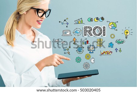 ROI text with business woman using a tablet
