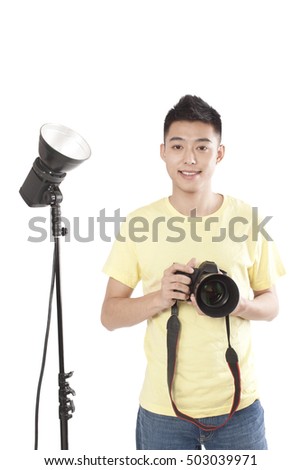 	Photographer holding camera,portrait	