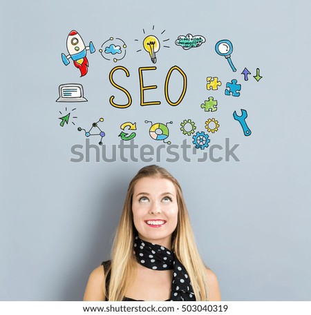 SEO concept with happy young woman on a gray background