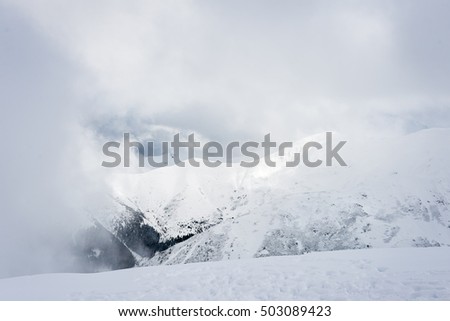 western carpathian mountain tops in winter covered in snow on a sunny day. slovakia