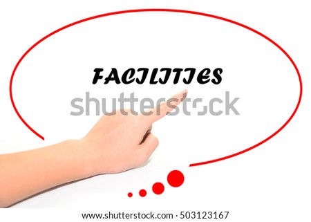 Hand writing FACILITIES with the finger pointing to the word on white background. This word represent the business as concept in stock photo.