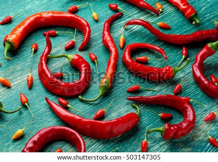 Red peppers on a flat surface. Image for use as background.