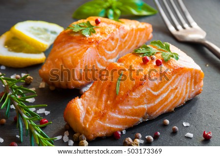 Delicious cooked salmon fish fillets Royalty-Free Stock Photo #503173369