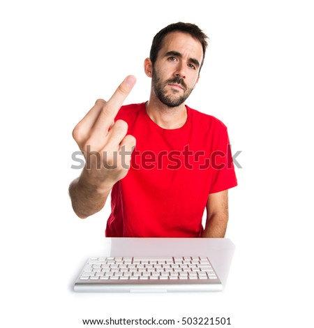 Computer technician working with his keyboard making horn gesture