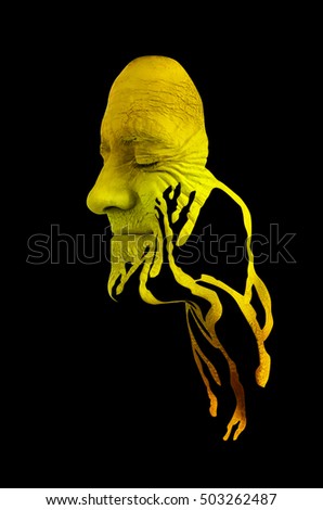Creative makeup. Conceptual idea of bold body art painting. Abstract picture isolated on black on male face.