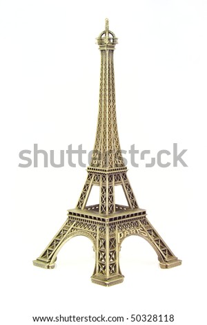 Gold Eiffel tower figurine isolated over white background