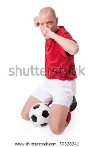 Full isolated studio picture from a young soccer player with ball
