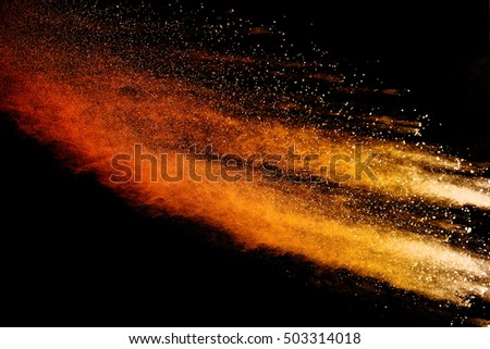 abstract powder splatted background,Freeze motion of orange powder exploding/throwing orange dust