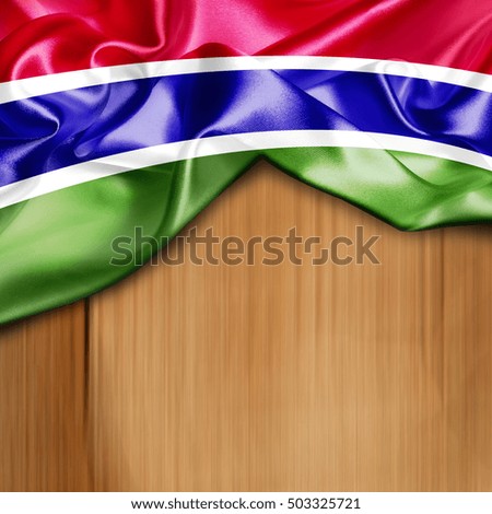 Gambia Country Flag on Wood background
