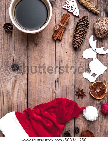 Cup of coffee and Santas hat, Christmas set, gift and Christmas tree. Celebration