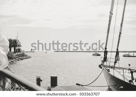 Yachting sail mast detail on sunny sky background