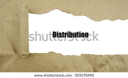 Torn brown paper on white surface with "distribution" word.