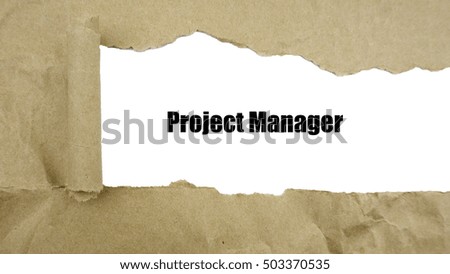 Torn brown paper on white surface with "project manager" word.