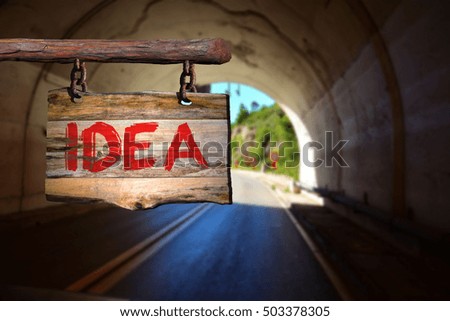 Idea motivational phrase sign on old wood with blurred background