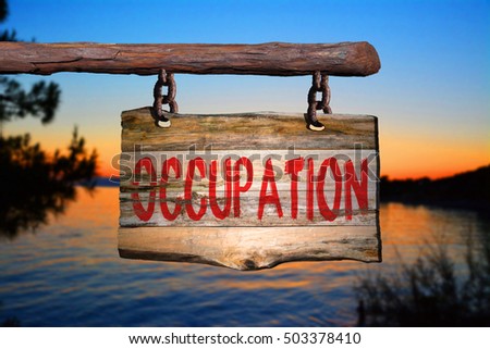Occupation motivational phrase sign on old wood with blurred background