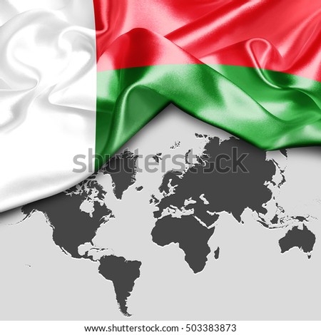 Abstract waving Madgascar flag over world map