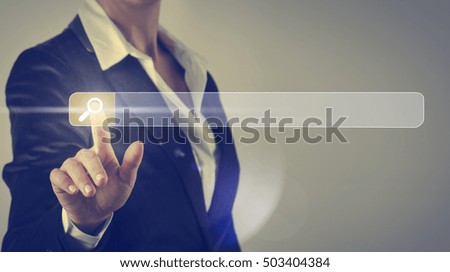 Business woman touching the search screen