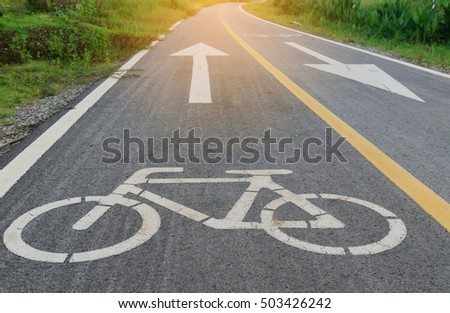 Bicycle lane on the road with nature way