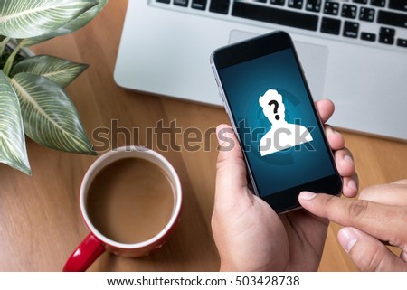 hand phone, who is calling Thoughtful male person looking to the digital phone screen,Silhouette top computer and hand