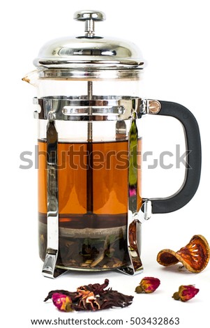 Glass teapot with tea press. Studio Photo