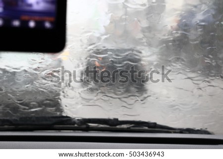 
Silhouette edge The rain is falling. Bokeh on the road in the morning. In Thailand.Abstract blurred background : Traffic jam in the morning rush hour. in-Thailand.