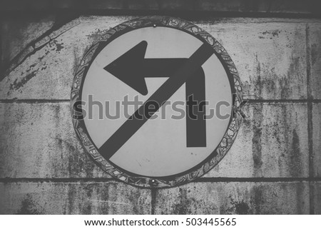 Do not turn left traffic sign on black and white