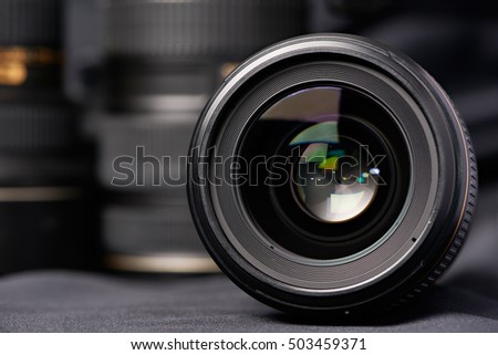 Photo lens front view on blurred background