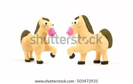Fighting of cute horse modeling clay isolated on white background.