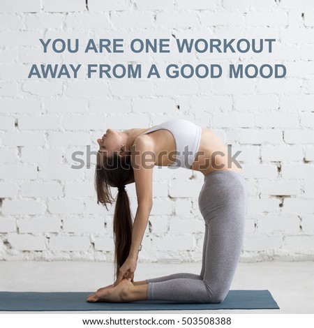 Beautiful young woman working out in loft interior, doing yoga exercise, stretching, standing in Ustrasana, Camel Posture, full length. Motivational text "You are one workout away from a good mood"