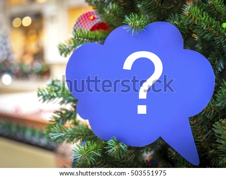 Question sign on a christmas tree in shopping mall