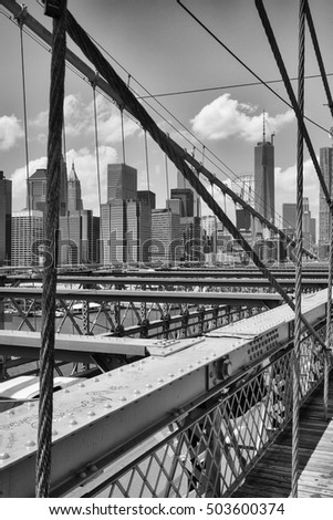 View from historic Brooklyn Bridge to  New York City, New York, USA. Black and White Image