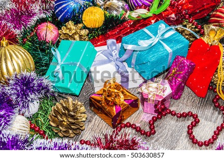 New year picture. Gifts boxes, Christmas decorations, tinsel and beads