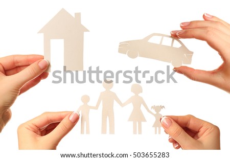 Hand holding a paper home, car, family on white background