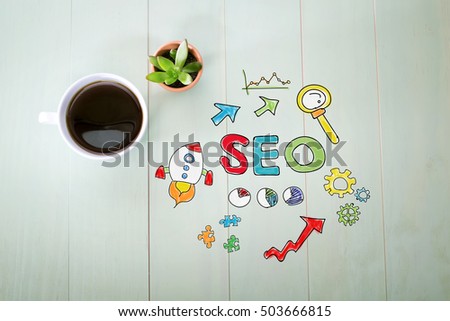 SEO concept with a cup of coffee on a pastel green wooden table