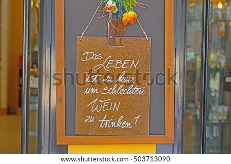 Life is too short to drink bad wine German text at the entrance to the wine shop