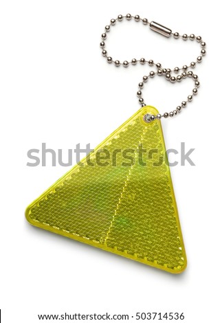 Yellow pedestrian safety reflector keyring isolated on white Royalty-Free Stock Photo #503714536
