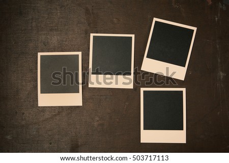 Retro Vintage empty Photo frames on old dark Background. Top view with copy space. Toned concept.