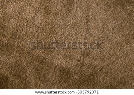 Synthetic fur brown background.