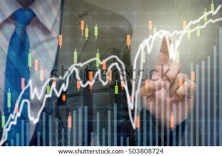 Businessman pointing or touching the trading graph of stock market on the virtual screen on photo blurred of cityscape background, Business stock market concept