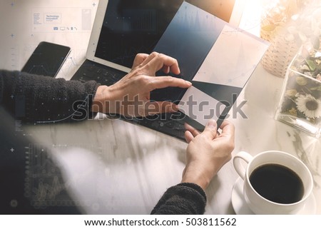 Businessperson Hands holding New Gift or Credit card,digital tablet computer dock keyboard,smart phone on marble desk,filter effect,icons screen