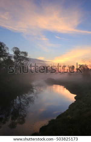 autumn landscape amazing misty dawn in the grove on the banks of the river 