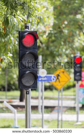 Red traffic signal on the street. / copy space
